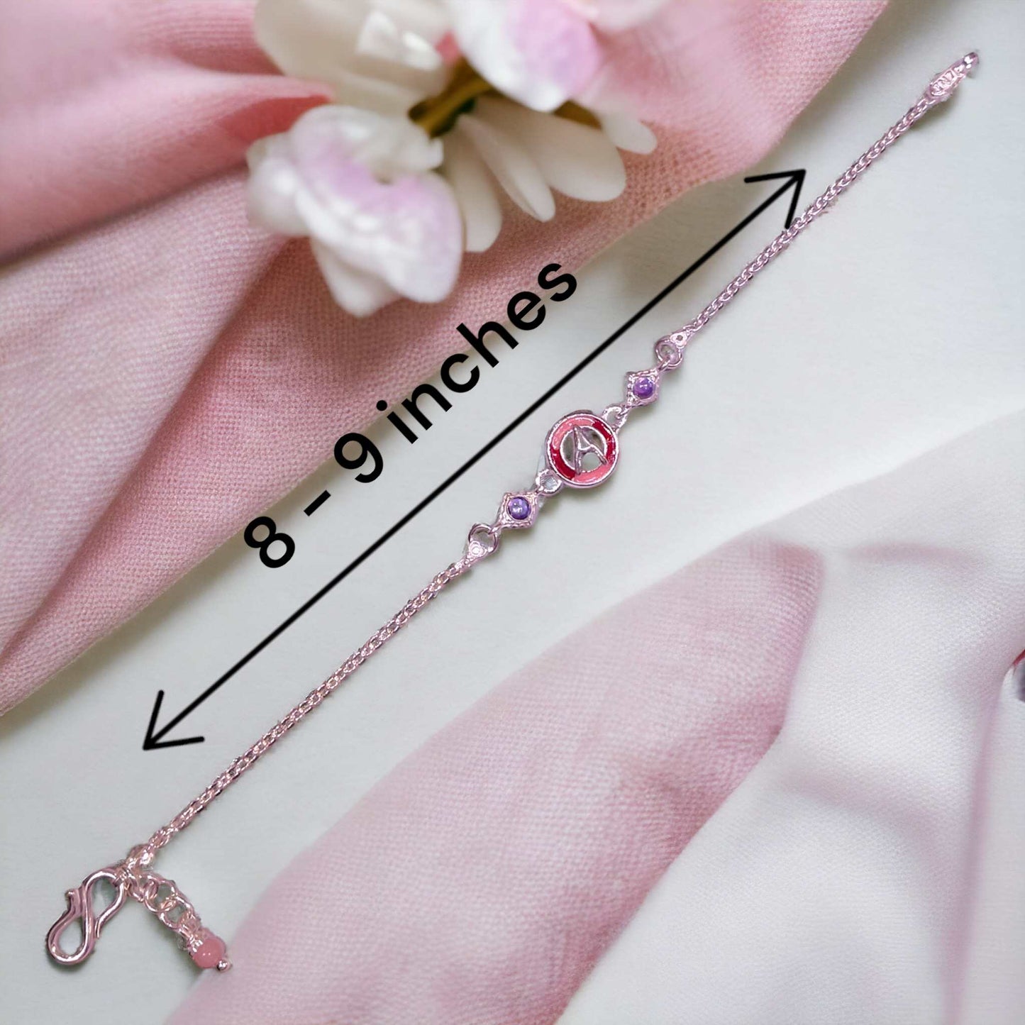 Silver letter rakhi