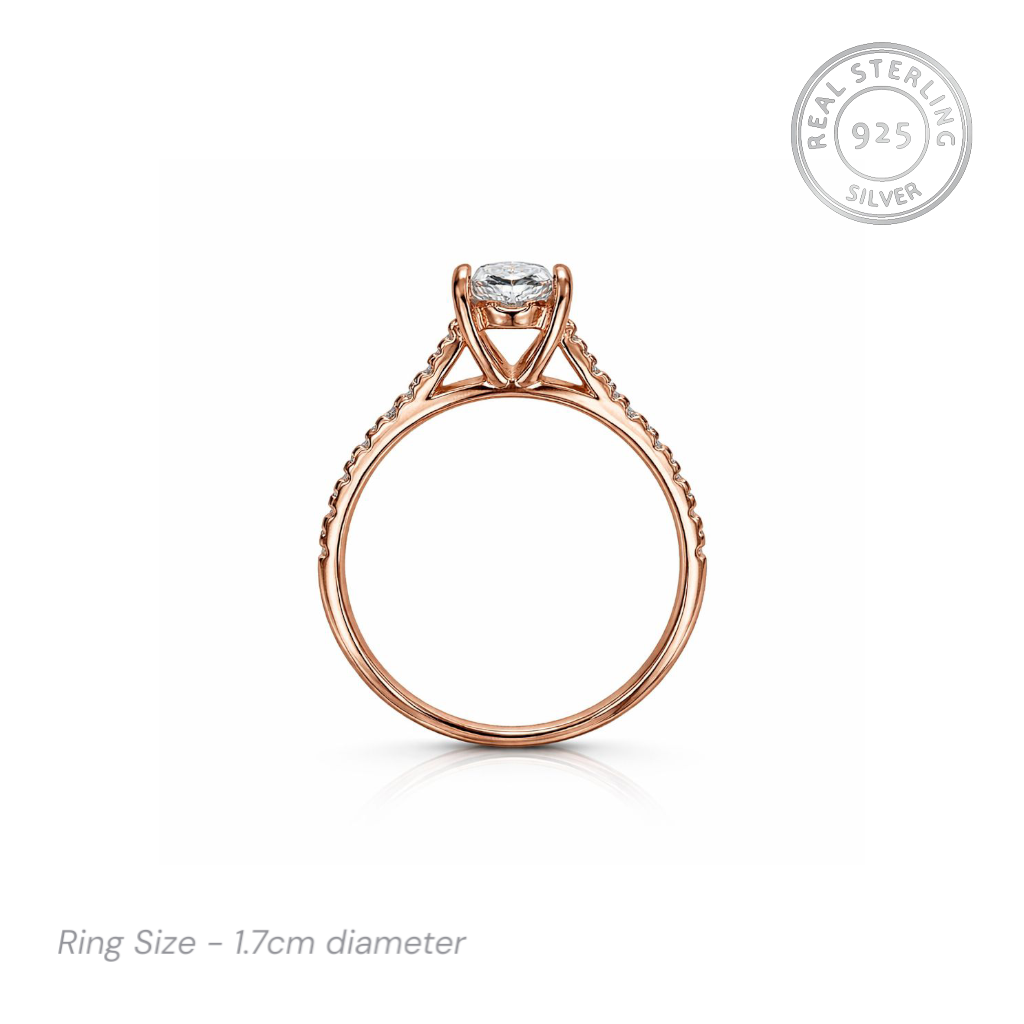 Rose gold ring with cz stones on a white background