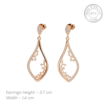 Rose gold plated earrings with cz accents on a white background, featuring 'Real Sterling 925' stamp.