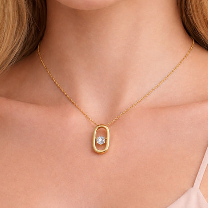 Model wearing a gold plated 925 sterling silver open oval pendant necklace with a single round cubic zirconia