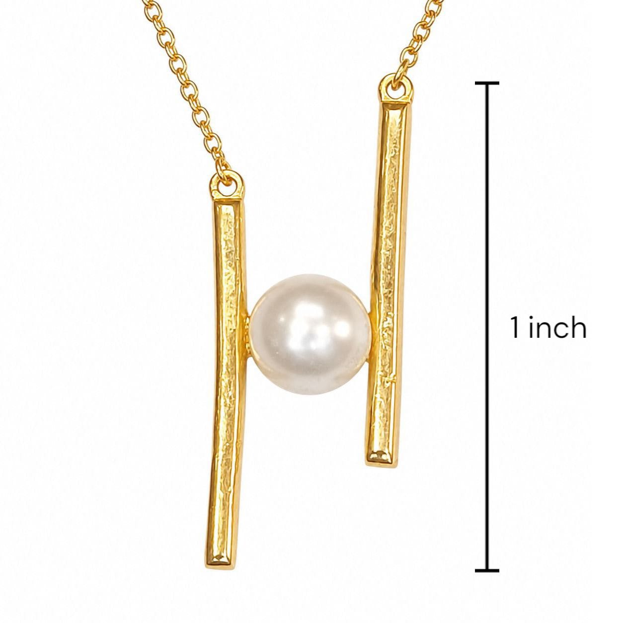 Sterling silver Gold necklace with a pearl pendant suspended between two vertical bar elements, shown on a white background with a black measurement marker reading 1 inch.
