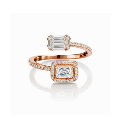 Rose gold ring with emerald-cut cz stones on a white background