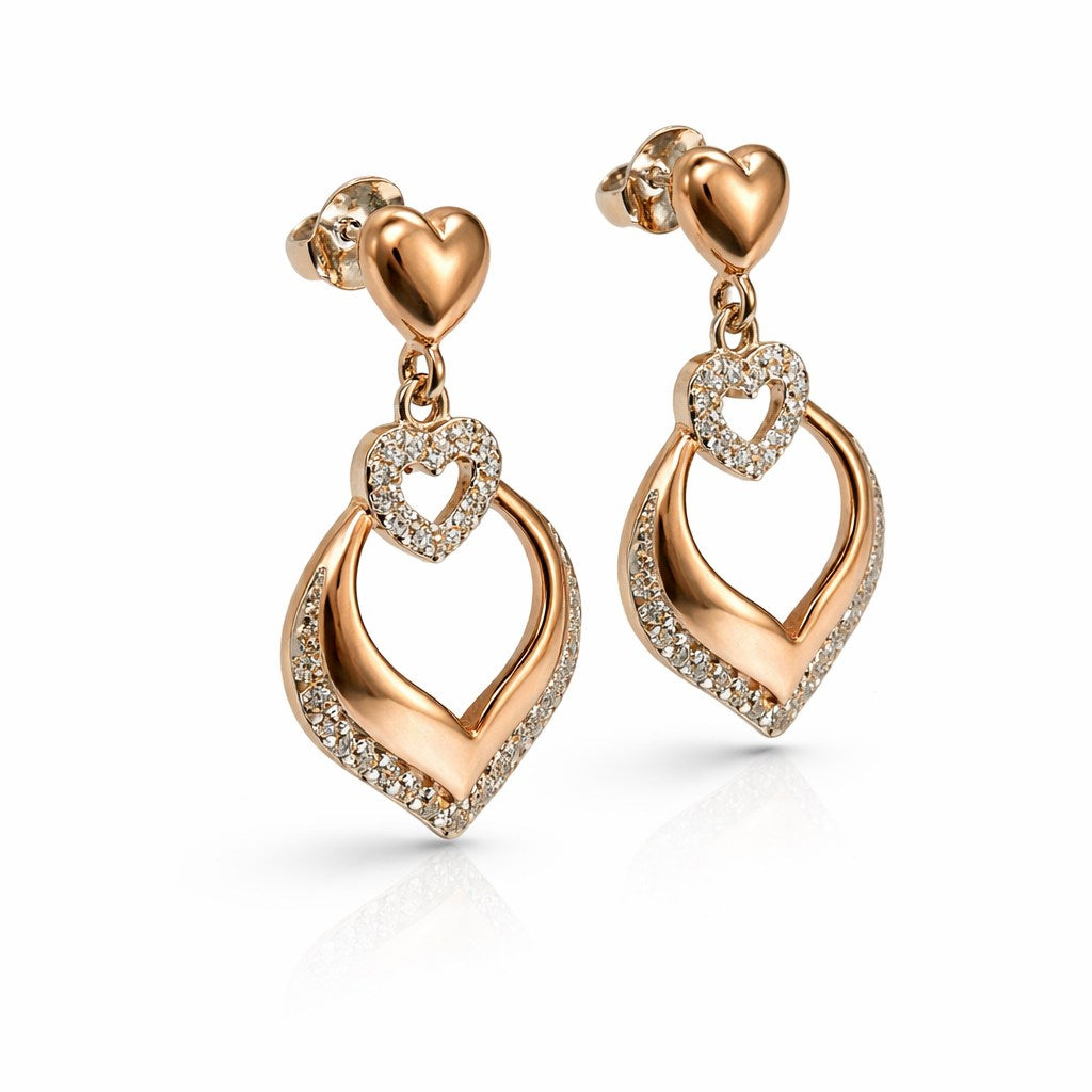 Side view of sterling silver rose gold heart drop cz earrings