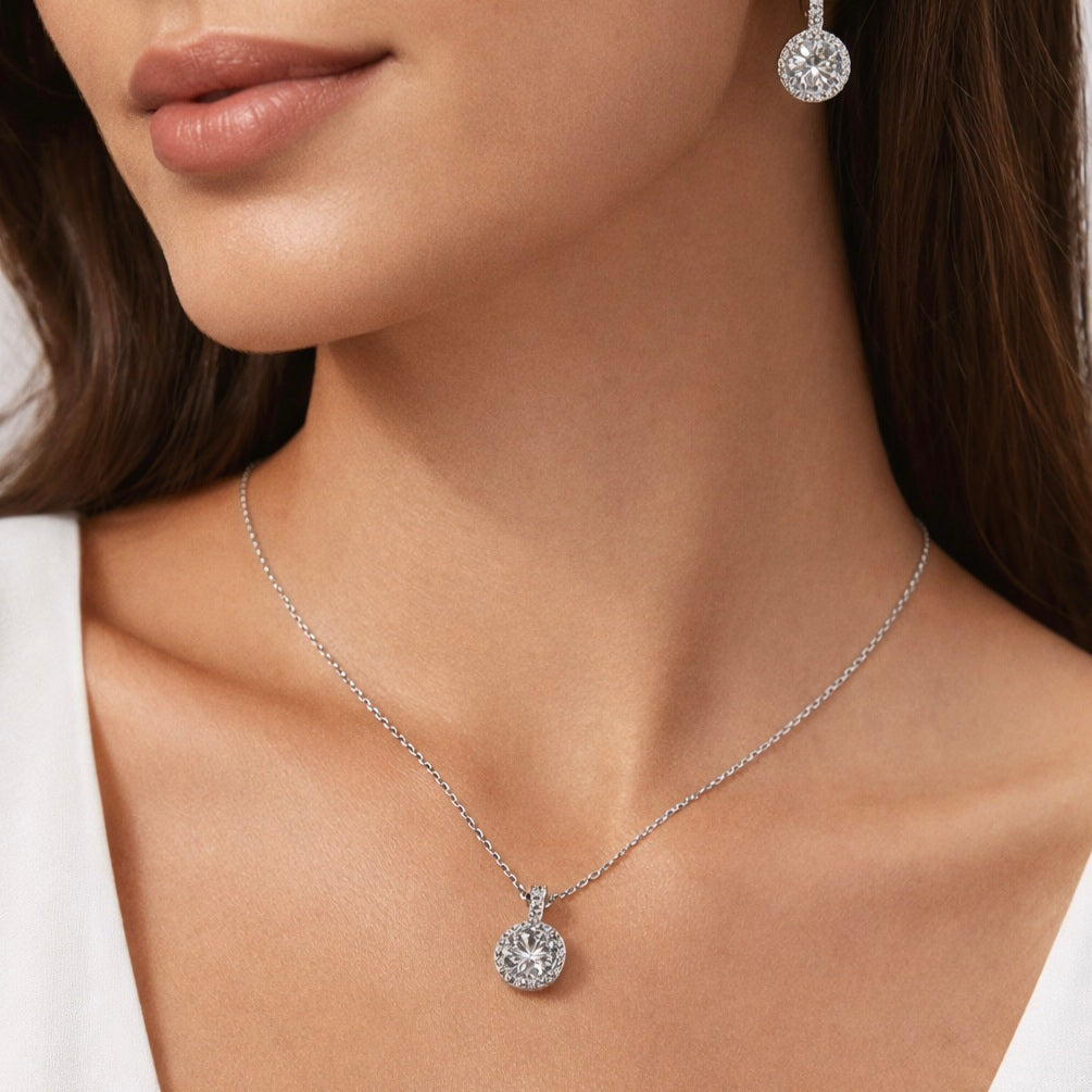 “925 sterling silver round halo CZ necklace and earrings worn by model”