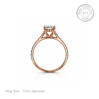 Rose gold ring with cz stones on a white background