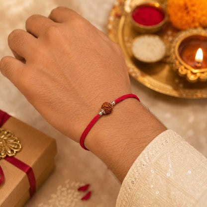 Silver rakhi with rudraksha by jauhari jewellers
