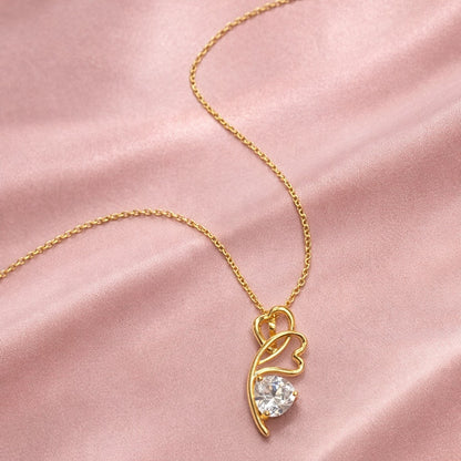 925 sterling silver Gold necklace with a heart-shaped pendant on a pink satin background