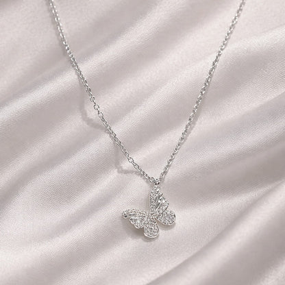 925 Silver butterfly necklace on a soft white fabric background