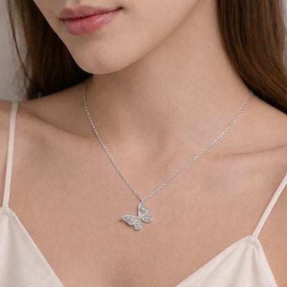 Sterling silver butterfly necklace worn by a model